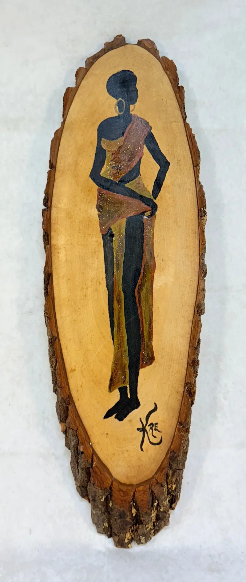 Wooden Wall Sculpture Featuring An African Female Figure 1